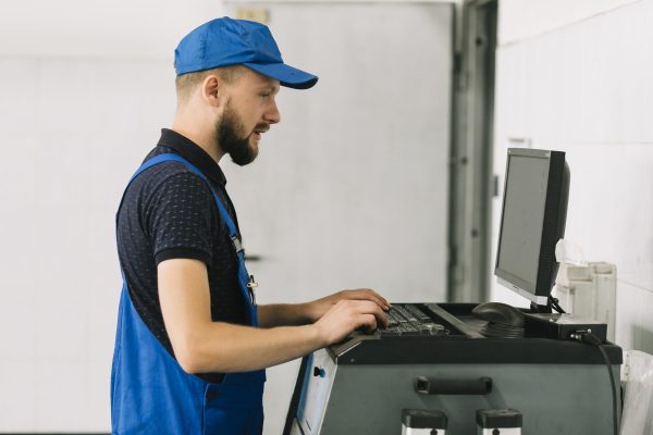 technician-typing-keyboard-garage