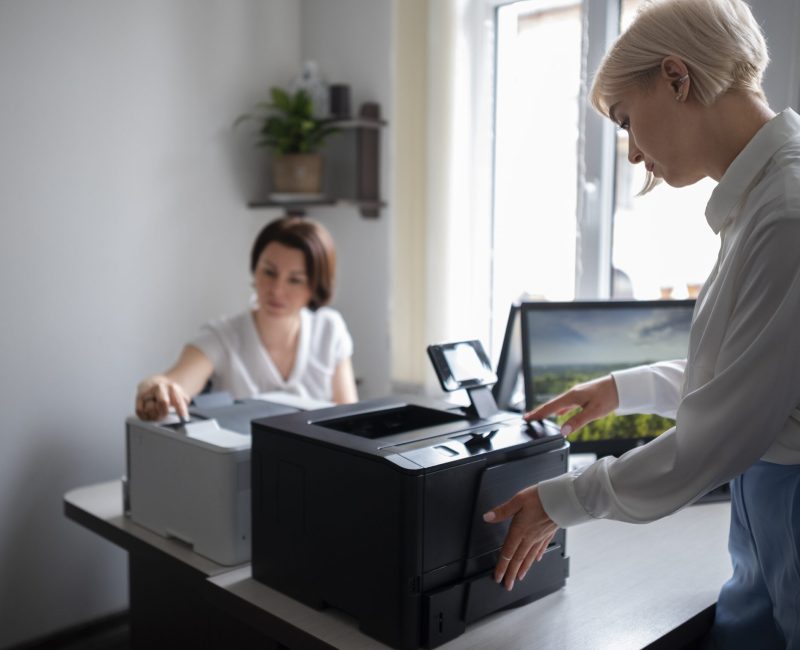 women-work-office-using-printer